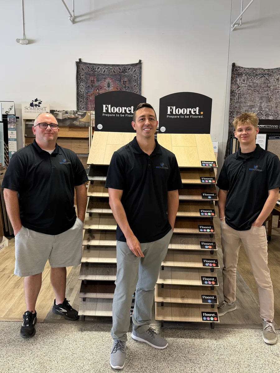 The Best Flooring team in their showroom with flooring sample displays